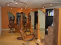 Tangles Hair Design and Day Spa West cutting stations